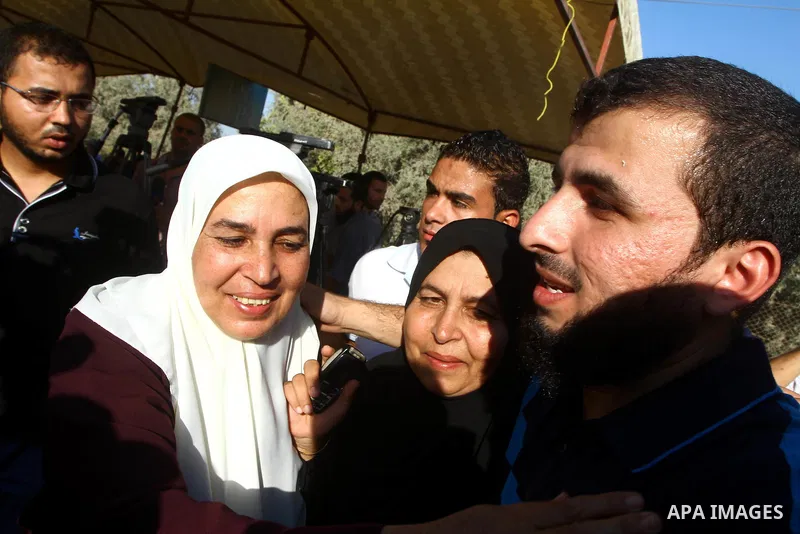 Palestinians welcome back prisoners released from Israeli prisons at the Erez checkpoint in the northern Gaza Strip, following their release at the Erez crossing by Israeli border police, 04 August 2011. In total, 75 Pal...