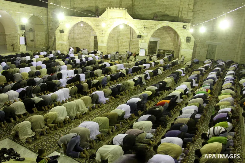 Palestinian Muslims pray al-Taraweeh prayer at al-Omari Mosque during the first Friday of the holy month of Ramadan in Gaza city on Aug. 5, 2011. Photo by Mohammed Asad
