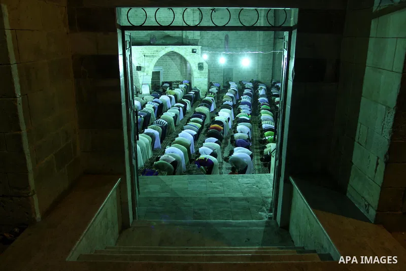 Palestinian Muslims pray al-Taraweeh prayer at al-Omari Mosque during the first Friday of the holy month of Ramadan in Gaza city on Aug. 5, 2011. Photo by Mohammed Asad