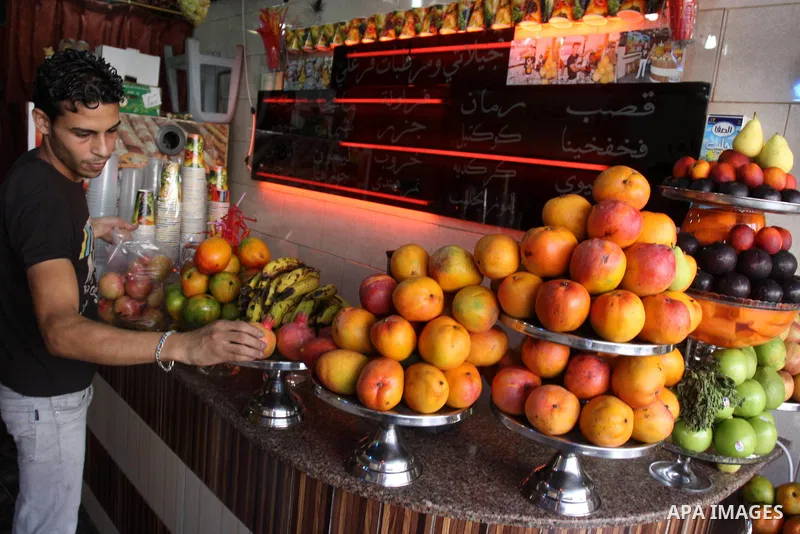 Palestinian vendor prepares different types of juice at his shop on the sixth day of the holy month of Ramadan in Gaza City on Aug. 6, 2011 . Muslims all over the world fast from dawn to dusk during the holy month of Ram...