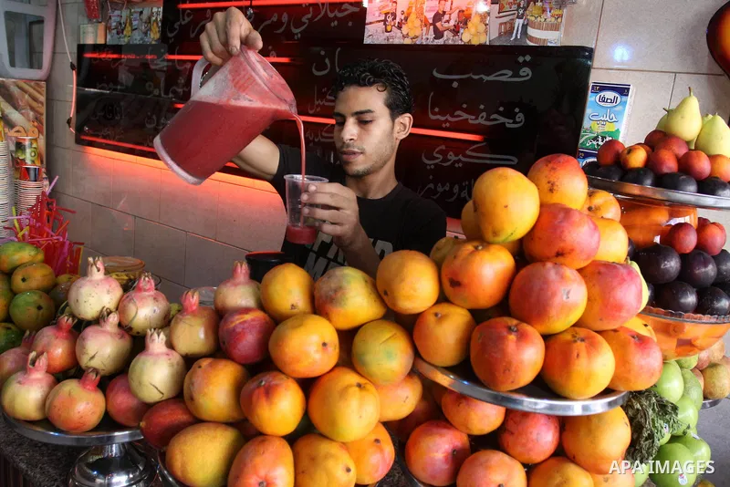 Palestinian vendor prepares different types of juice at his shop on the sixth day of the holy month of Ramadan in Gaza City on Aug. 6, 2011 . Muslims all over the world fast from dawn to dusk during the holy month of Ram...