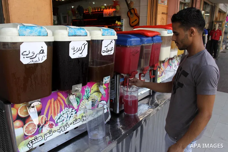 Palestinian vendor prepares different types of juice at his shop on the sixth day of the holy month of Ramadan in Gaza City on Aug. 6, 2011 . Muslims all over the world fast from dawn to dusk during the holy month of Ram...