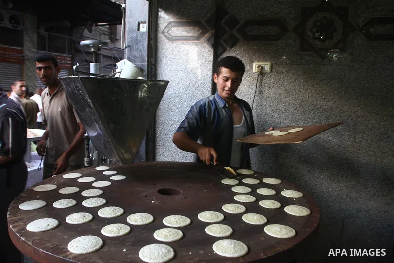 A Palestinian vendor prepares qatayef, a traditional pancake for Ramadan, at a shop in Gaza city on Aug. 6, 2011. Muslims around the world abstain from eating, drinking and conducting sexual relations from sunrise to sun...