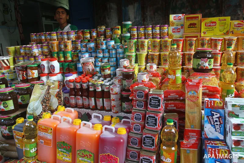 A Palestinian vendor sells food at a market in Gaza city on Aug. 6, 2011. Muslims around the world abstain from eating, drinking and conducting sexual relations from sunrise to sunset during Ramadan, the holiest month in...