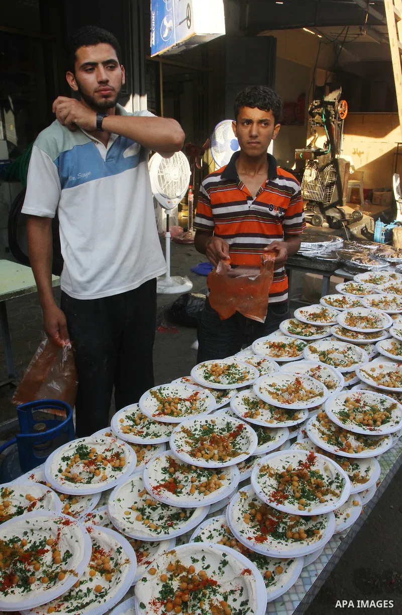 A Palestinian vendor sells chickpeas at a market in Gaza city on Aug. 6, 2011. Muslims around the world abstain from eating, drinking and conducting sexual relations from sunrise to sunset during Ramadan, the holiest mon...