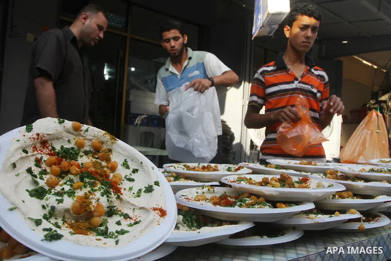 A Palestinian vendor sells chickpeas at a market in Gaza city on Aug. 6, 2011. Muslims around the world abstain from eating, drinking and conducting sexual relations from sunrise to sunset during Ramadan, the holiest mon...