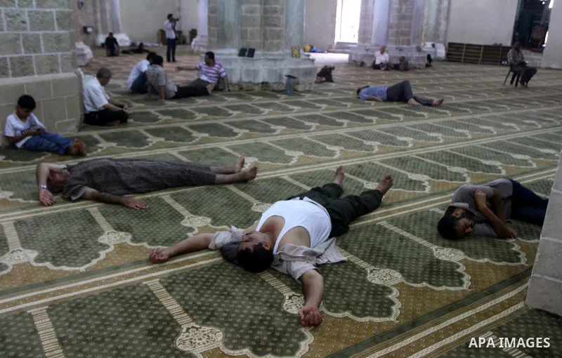 Palestinians rest at al-Omari Mosque during a fasting day of Ramadan in Gaza City, on Aug. 6, 2011. Muslims around the world refrain from eating, drinking and sexual intercourse from dawn till dusk during Ramadan, the ho...