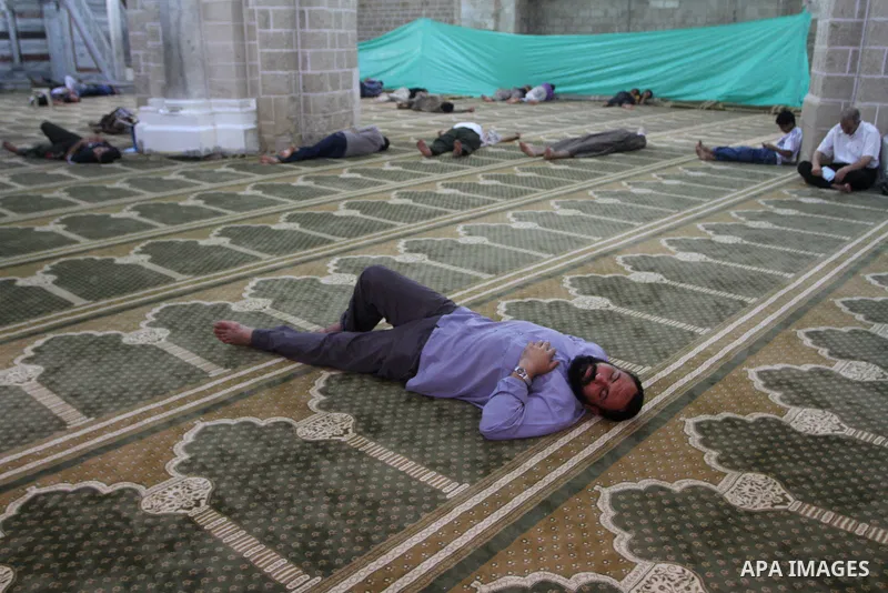 Palestinians rest at al-Omari Mosque during a fasting day of Ramadan in Gaza City, on Aug. 6, 2011. Muslims around the world refrain from eating, drinking and sexual intercourse from dawn till dusk during Ramadan, the ho...