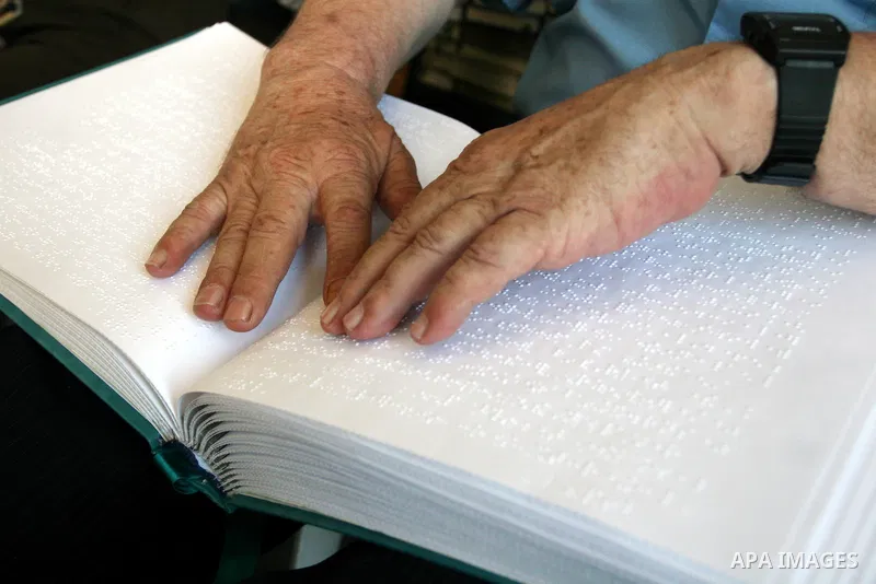 A Palestinian old man, Abdel Fattah Mubarak, 67 years, reads the holy koran in Braille at a Mosque in the West Bank city of Ramallah, on Aug. 7, 2011. Muslims around the world are observing the holy fasting month of Rama...