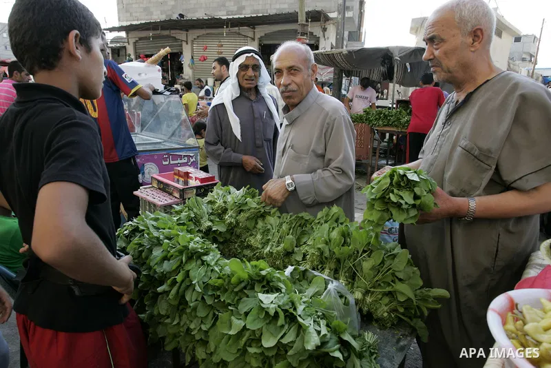 Palestinians shop for food at a market in Rafah southern Gaza Strip on Augu. 7, 2011. Muslims around the world abstain from eating, drinking and conducting sexual relations from sunrise to sunset during Ramadan, the holi...