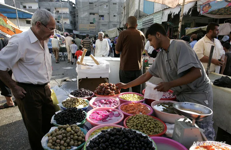 A Palestinian vendor sells pickles at a market in Rafah, southern Gaza Strip on Aug. 7, 2011. Muslims around the world abstain from eating, drinking and conducting sexual relations from sunrise to sunset during Ramadan,...