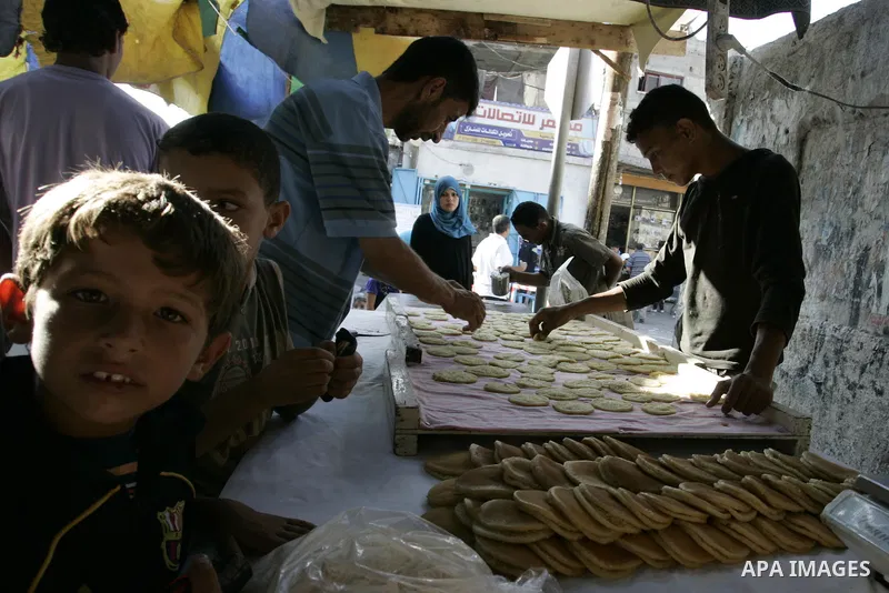 A Palestinian vendor prepares qatayef, a traditional pancake for Ramadan, at a shop in Rafah, southern Gaza Strip on Aug. 7, 2011. Muslims around the world abstain from eating, drinking and conducting sexual relations fr...