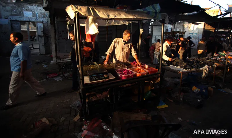 Palestinian kids sleep on a donkey cart in the market before Palestinians break their fast on the first Friday of Ramadan in the Jabaliya Refugee Camp in the northern Gaza Strip on 07 August 2011 Muslims throughout the w...