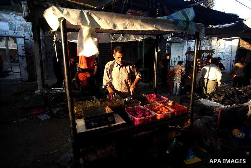Palestinian kids sleep on a donkey cart in the market before Palestinians break their fast on the first Friday of Ramadan in the Jabaliya Refugee Camp in the northern Gaza Strip on 07 August 2011 Muslims throughout the w...