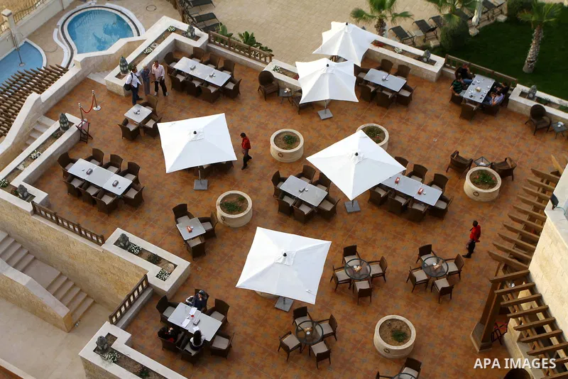 In this photo taken Monday, Aug. 8, 2011, showing Gaza Strip's first five-star Arcmed Al Mashtal hotel in Gaza City, which was recently opened. The eight-storey structure is an anomaly in Gaza, where most local people li...