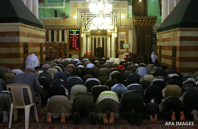 Palestinian men perform prayer at the Ibrahimi Mosque in the West Bank city of Hebron,on Aug. 8, 2011. Muslims around the world are observing the fasting month of Ramadan during which they refrain from eating, drinking,...