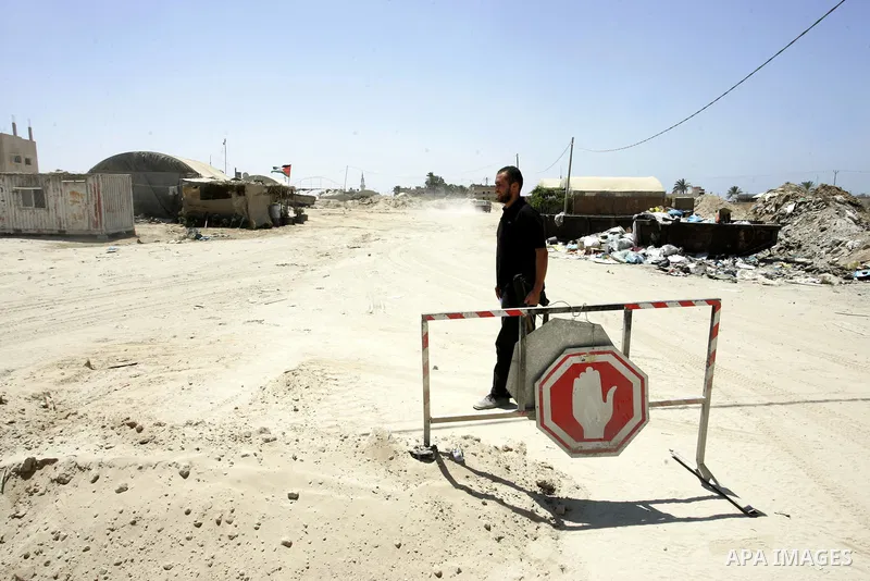 A Palestinian Hamas policeman during searching cars near the tunnels between Egypt and Gaza border, in part of a campaign to search vehicles, in Rafah, southern Gaza Strip on Aug. 8, 2011. Photo by Abed Rahim Khatib