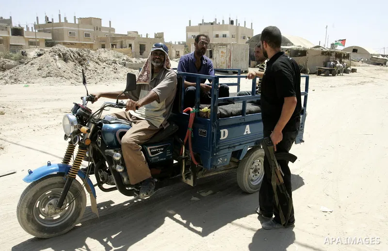 A Palestinian Hamas policeman during searching cars near the tunnels between Egypt and Gaza border, in part of a campaign to search vehicles, in Rafah, southern Gaza Strip on Aug. 8, 2011. Photo by Abed Rahim Khatib