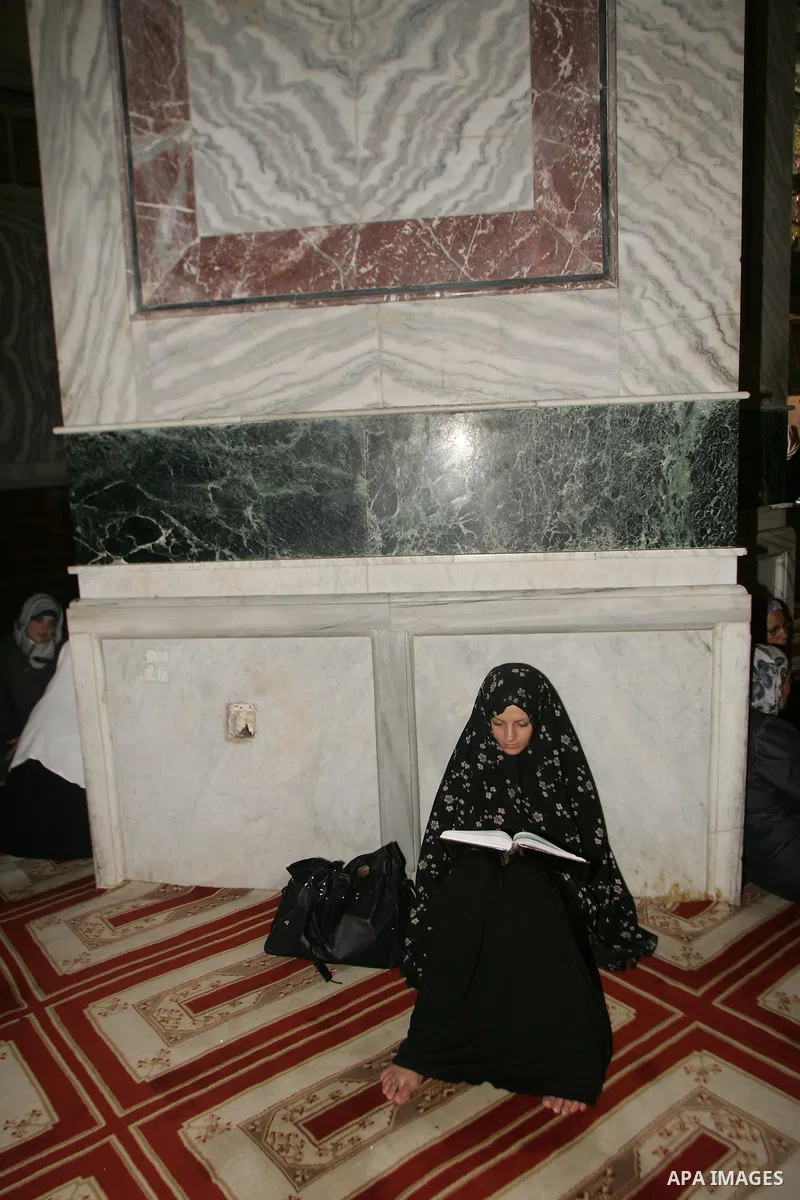 A Palestinian woman reads the holy koran on the first day of holy fasting month of Ramadan. Throughout the holy month of Ramadan devout Muslims must abstain from food, drink and sex from dawn until sunset when they break...