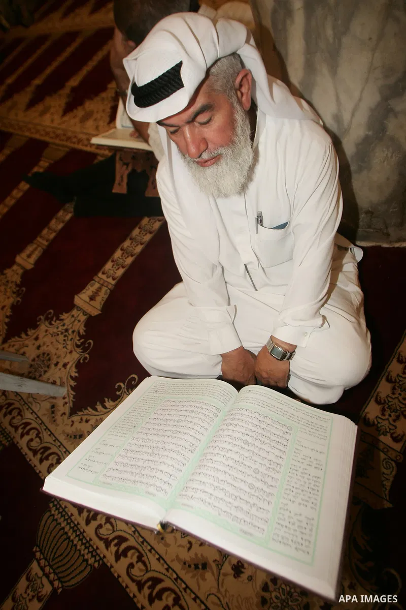 A Palestinian man reads the holy koran on the first day of holy fasting month of Ramadan. Throughout the holy month of Ramadan devout Muslims must abstain from food, drink and sex from dawn until sunset when they break t...