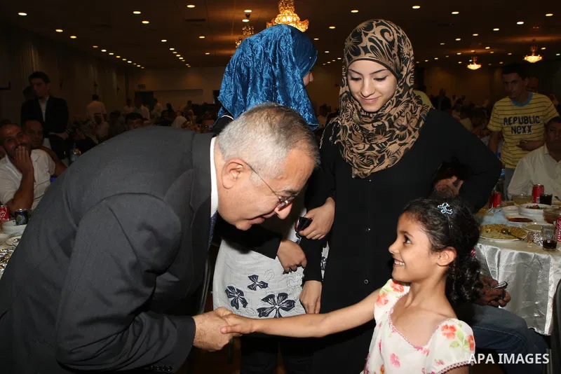 Palestinian Prime Minister Salam Fayyad, participates in the annual Ramadan breakfast for prisoners and families of the martyrs on Aug 8, 2011. Photo by Mustafa Abu Dayeh