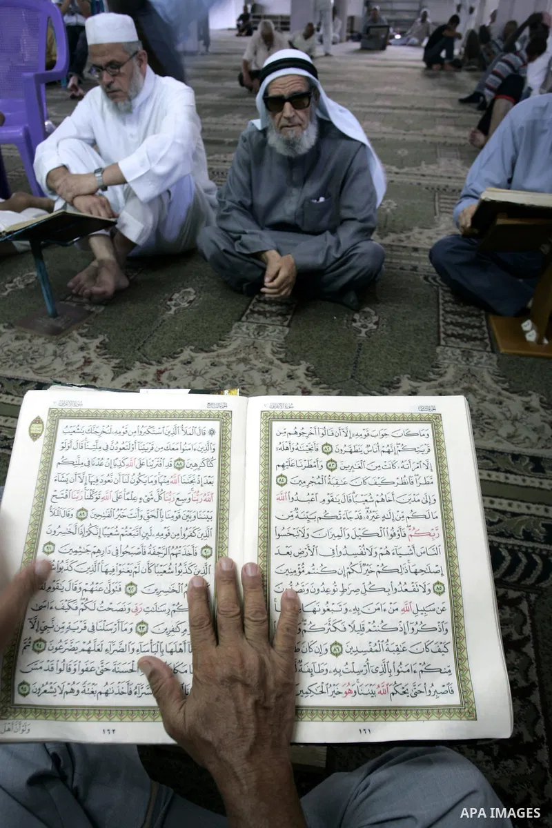 A Palestinian Muslim reads the holy Koran at a Mosque in Rafah, southern Gaza Strip on Aug. 9, 2011. Muslims around the world refrain from eating, drinking and sexual intercourse from dawn till dusk during Ramadan, the h...