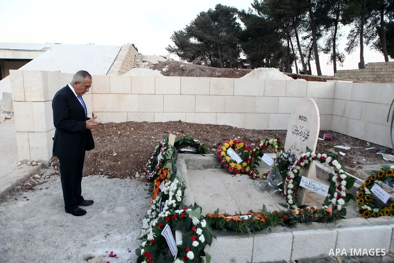 Palestinian Prime Minister, Salam Fayyad during placing a wreath at the tomb of the late Mahmoud Darwish, and reading al-Fateha on his pure soul to mark the third anniversary of his departure in the West Bank city of Ram...