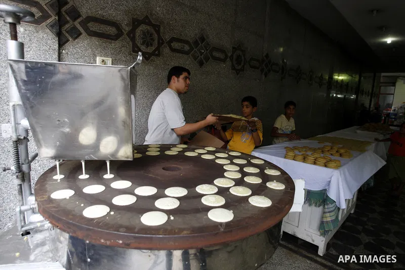 A Palestinian vendor prepares qatayef, a popular sweet during Ramadan, in a shop in Gaza city on Aug.10, 2011. Muslims around the world are observing the holy fasting month of Ramadan where they refrain from eating, drin...