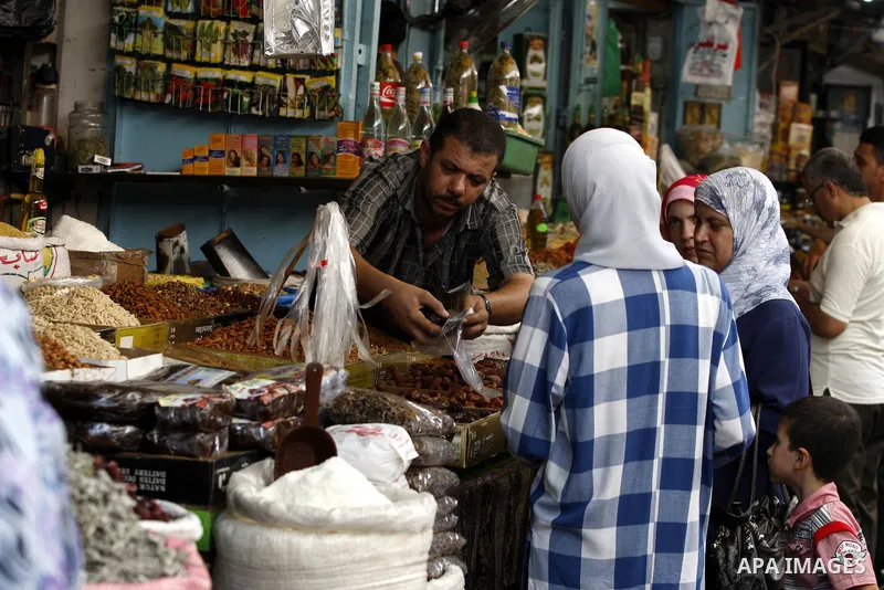 Palestinians shop for food at a market in Gaza city on Aug. 10, 2011. Muslims around the world abstain from eating, drinking and conducting sexual relations from sunrise to sunset during Ramadan, the holiest month in the...