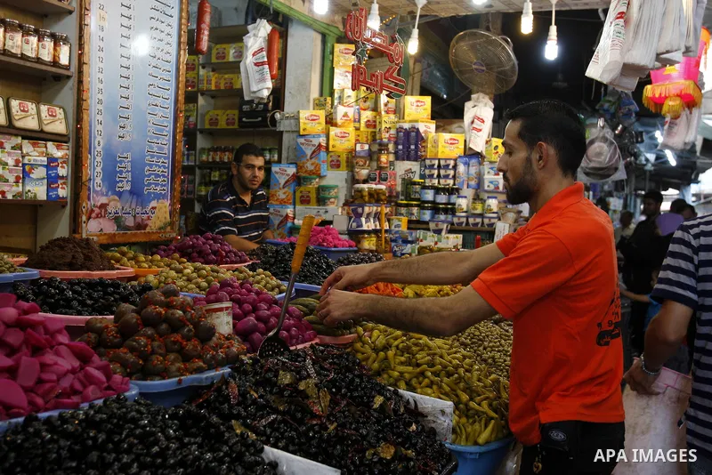 A Palestinian vendor sells pickles in his shop at a market in Gaza city Aug. 10, 2011. Muslims around the world abstain from eating, drinking and conducting sexual relations from sunrise to sunset during Ramadan, the hol...