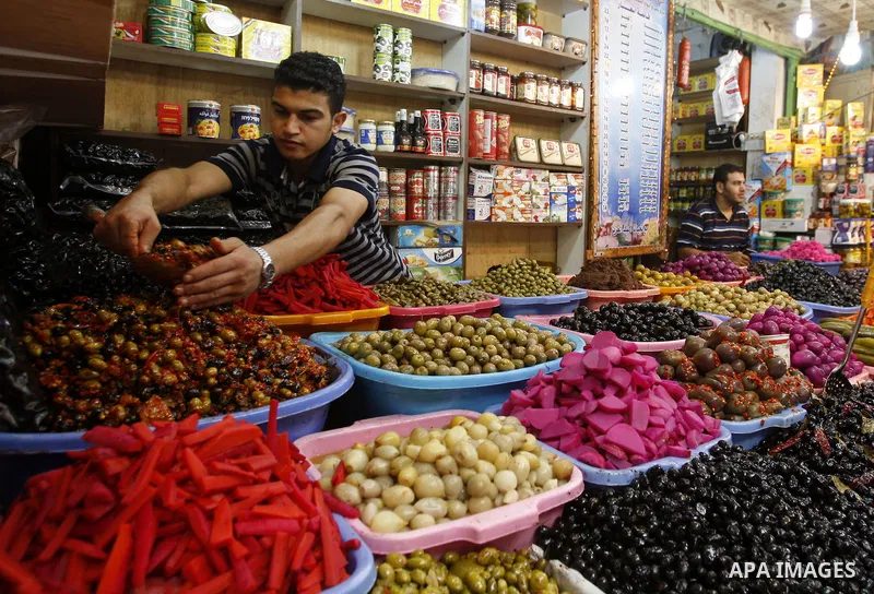 A Palestinian vendor sells pickles in his shop at a market in Gaza city Aug. 10, 2011. Muslims around the world abstain from eating, drinking and conducting sexual relations from sunrise to sunset during Ramadan, the hol...