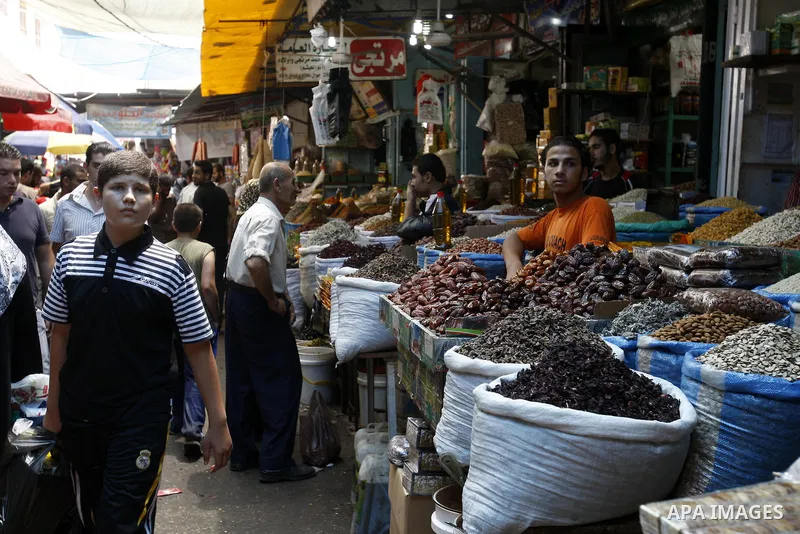Palestinians shop for food at a market in Gaza city on Aug. 10, 2011. Muslims around the world abstain from eating, drinking and conducting sexual relations from sunrise to sunset during Ramadan, the holiest month in the...
