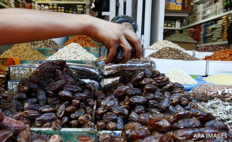 A Palestinian vendor sells dates in his shop at a market in Gaza city Aug. 10, 2011. Muslims around the world abstain from eating, drinking and conducting sexual relations from sunrise to sunset during Ramadan, the holie...
