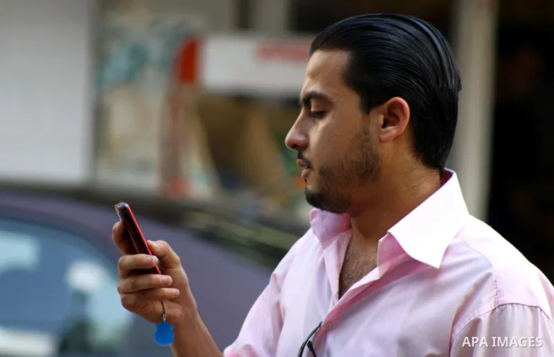 Palestinians try to call each other through the Palestinian communication services (Jawwal) but there are problems in communication because of the damage of Israeli attacks, yesterday evening in Gaza city on Aug. 10, 201...