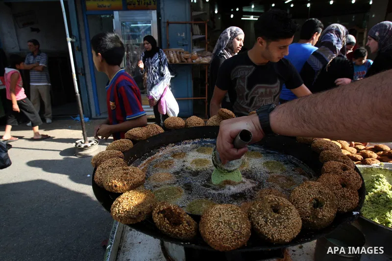 A Palestinian vendor prepares traditional foods "falafel", in a shop in the West Bank city of Nablus, on Aug. 10, 2011. Muslims around the world are observing the holy fasting month of Ramadan where they refrain from eat...