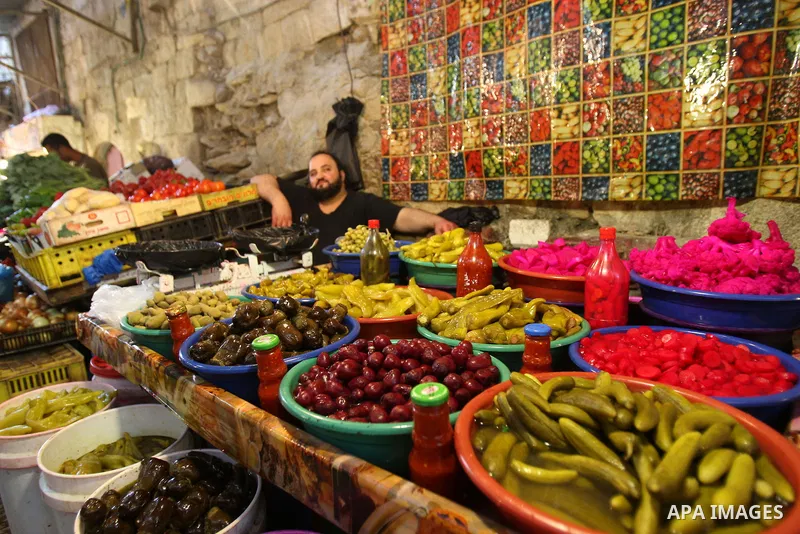 A Palestinian vendor sells pickles in his shop at a market in the West Bank city of Nablus, on Aug. 10, 2011. Muslims around the world are observing the holy fasting month of Ramadan where they refrain from eating, drink...