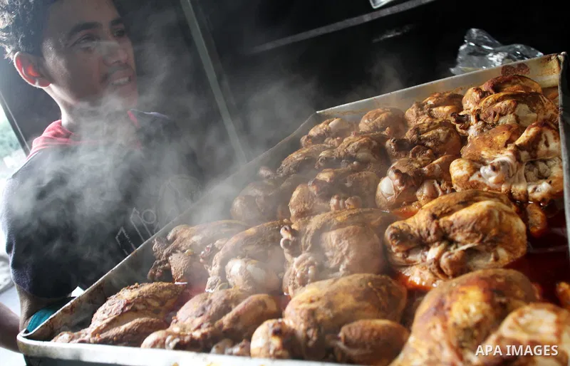 Palestinian bakers prepare chicken and rice 'Qedrah" in a traditional stove at Beirut Kitchen in Gaza city on Aug. 10, 2011, during the holy fasting month of Ramadan, when observant Muslims abstain from eating, drinking...