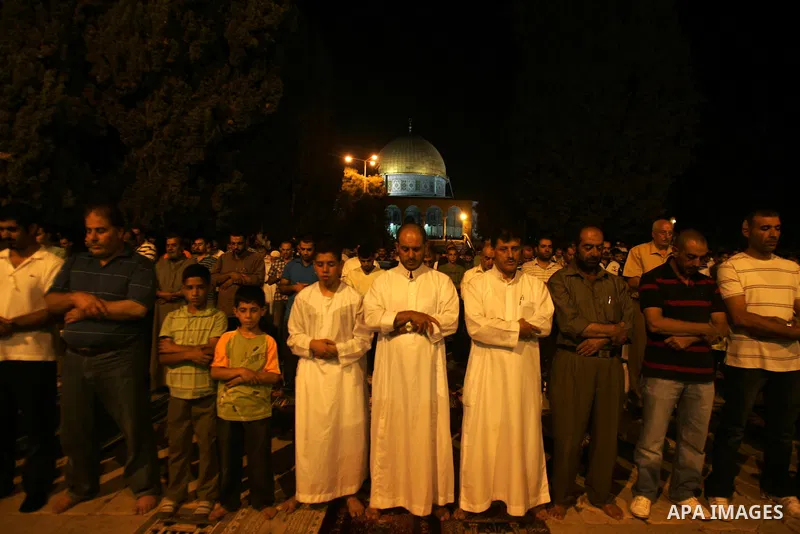 Palestinian Muslims perform al-Taraweeh prayer on the night of the tenth of the holiest month of Ramadan at Al Aqsa Mosque in the old city of Jerusalme on Aug. 10, 2011. Muslims around the world are observing the holy fa...
