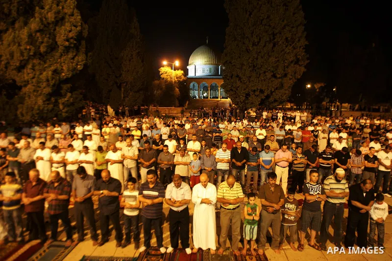 Palestinian Muslims perform al-Taraweeh prayer on the night of the tenth of the holiest month of Ramadan at Al Aqsa Mosque in the old city of Jerusalme on Aug. 10, 2011. Muslims around the world are observing the holy fa...