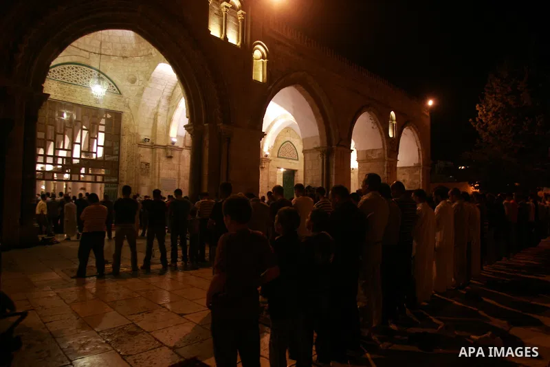 Palestinian Muslims perform al-Taraweeh prayer on the night of the tenth of the holiest month of Ramadan at Al Aqsa Mosque in the old city of Jerusalme on Aug. 10, 2011. Muslims around the world are observing the holy fa...