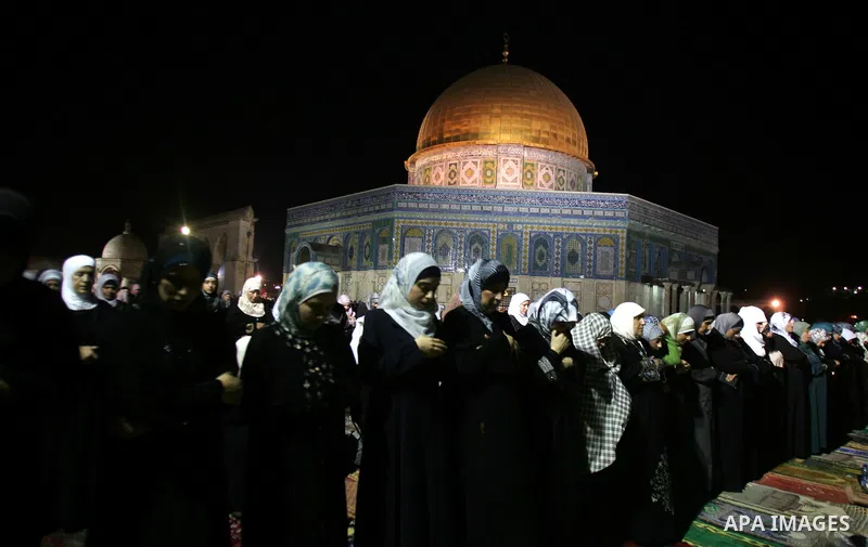 Palestinian Muslims perform al-Taraweeh prayer on the night of the tenth of the holiest month of Ramadan at Al Aqsa Mosque in the old city of Jerusalme on Aug. 10, 2011. Muslims around the world are observing the holy fa...