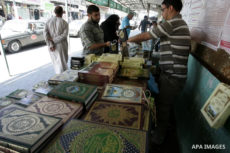 A Palestinian man sells the holy koran and Islamic books in his shop at a market in Rafah, southern Gaza Strip on Aug. 11, 2011. Muslims throughout the world are marking the month of Ramadan, during which they refrain fr...