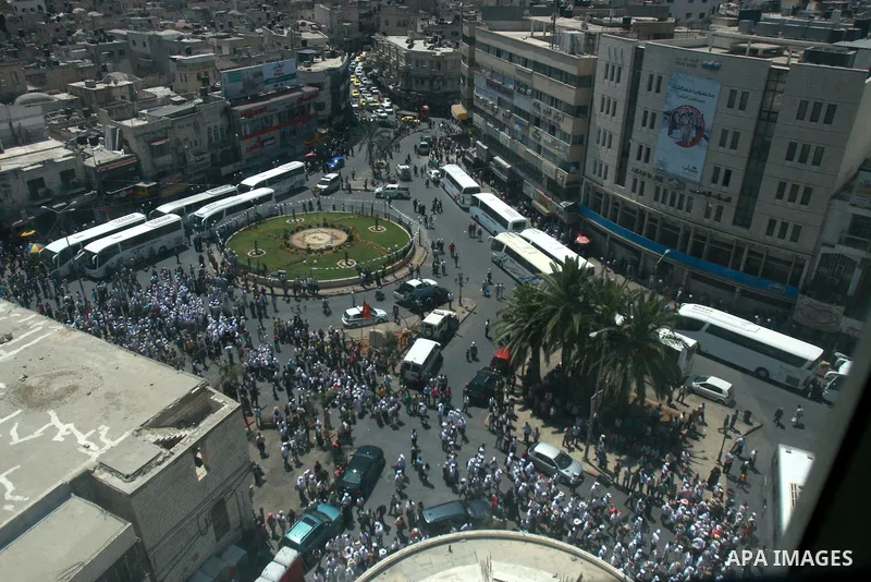 Foreign supporters with the Palestinian people take part in a demonstration in the West Bank city of Nablus, on Aug. 11, 2011. In support with the Palestinian people, where gather more than 1,200 activists from 22 foreig...