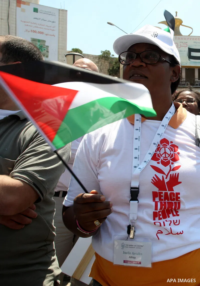 Foreign supporters with the Palestinian people take part in a demonstration in the West Bank city of Nablus, on Aug. 11, 2011. In support with the Palestinian people, where gather more than 1,200 activists from 22 foreig...