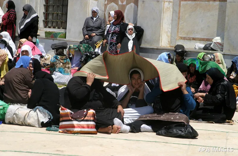 Palestinians gather for prayers at the Al Aqsa Mosque in Jerusalem, on the second Friday of the Muslim holy month of Ramadan, Friday Aug. 12, 2011. Muslims around the world are observing the holy fasting month of Ramadan...