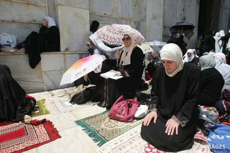 Palestinians gather for prayers at the Al Aqsa Mosque in Jerusalem, on the second Friday of the Muslim holy month of Ramadan, Friday Aug. 12, 2011. Muslims around the world are observing the holy fasting month of Ramadan...
