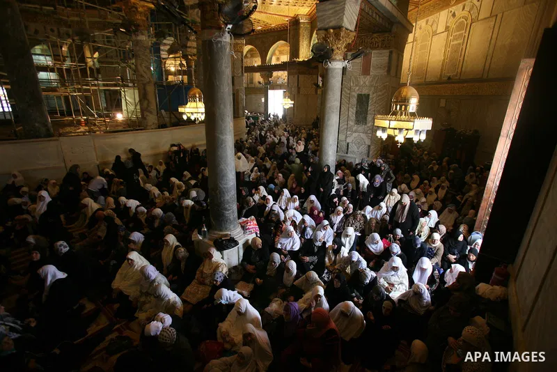 Palestinian Muslims pray in the Dome of the Rock on the compound known to Muslims as al-Haram al-Sharif and to Jews as Temple Mount during the second Friday of the holy month of Ramadan in Jerusalem's Old City on Aug. 12...