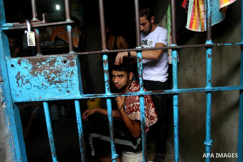 A Palestinian prisoner during Shaving his hair in a Hamas-run jail on the fourteenth day during the holy month of Ramadan in Gaza City on Aug. 14, 2011. Muslims around the world are observing the holy fasting month of Ra...