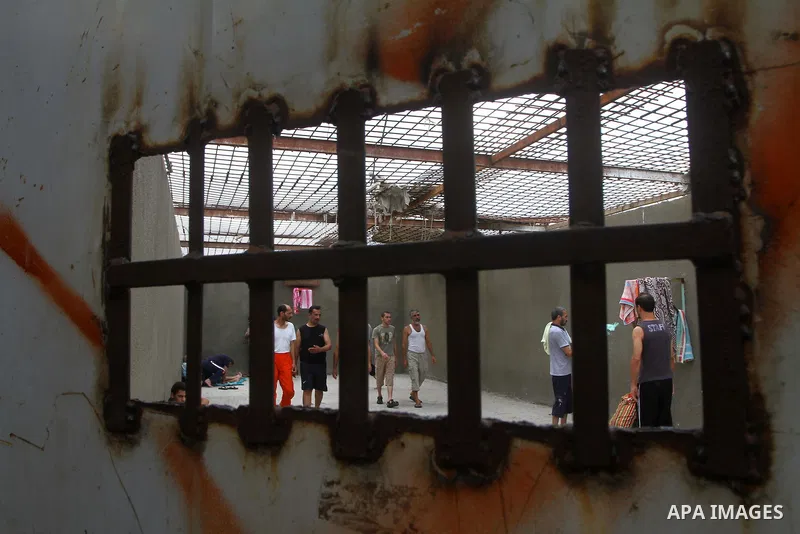 Palestinian prisoners walk in a Hamas-run jail on the fourteenth day during the holy month of Ramadan in Gaza City on Aug. 14, 2011. Muslims around the world are observing the holy fasting month of Ramadan in which they...