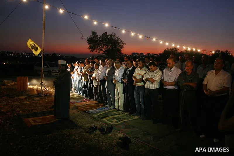 Palestinian Prime Minister Salam Fayyad, participates in the Ramadan breakfast for Journalists in West Bank City of Ramallah, on Aug 8, 2011. Photo by Issam Rimawi